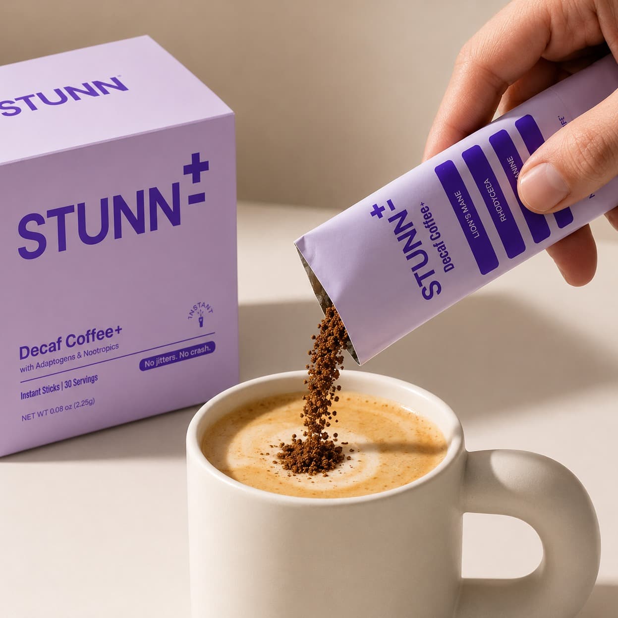 STUNN decaf coffee sachet being poured into a prepared cup